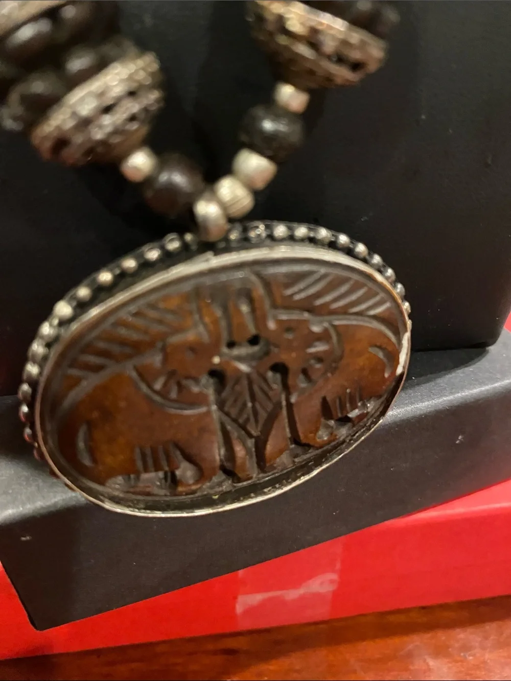 Handcrafted Elephant Pendant Necklace - Brown. Small elephants are bone.